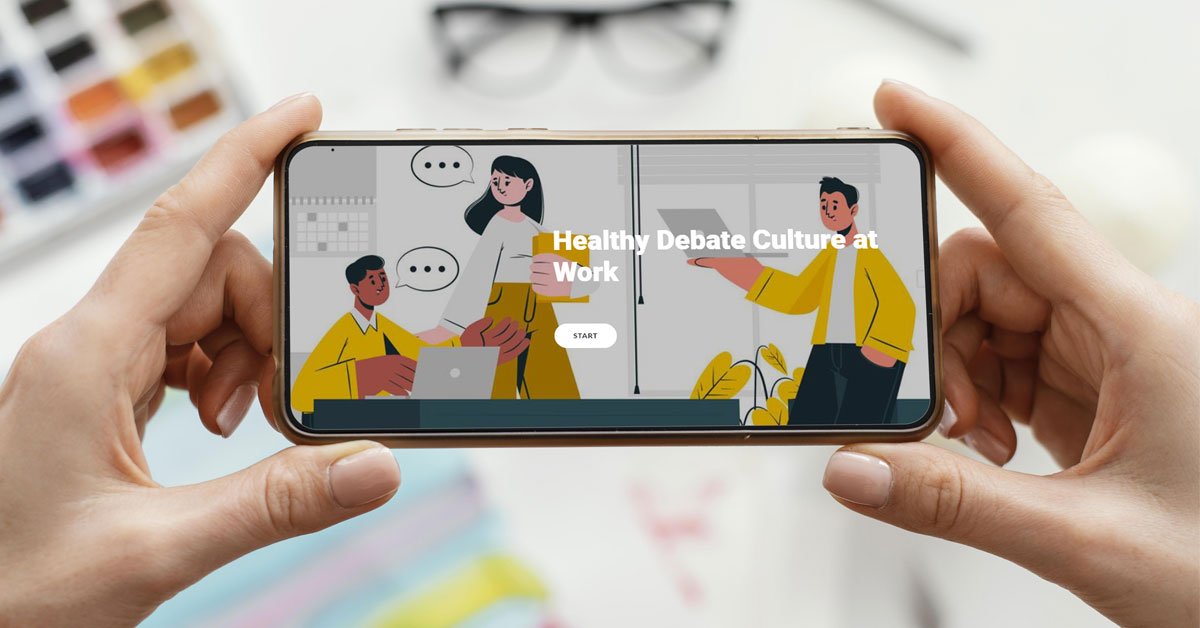 Two hands holding a smartphone with the start page of Healthy Debate Culture on the display